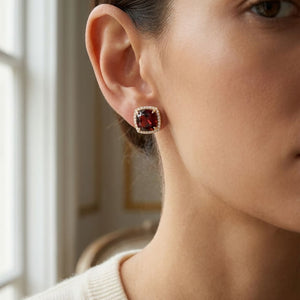 Garnet Cushion Stud Earrings in 14K Yellow Gold, worn close-up portrait