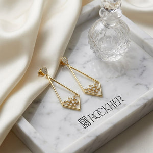 Diamond Pave Elongated Diamond Shaped Earrings in 14K Yellow Gold, on marble vanity tray with silk