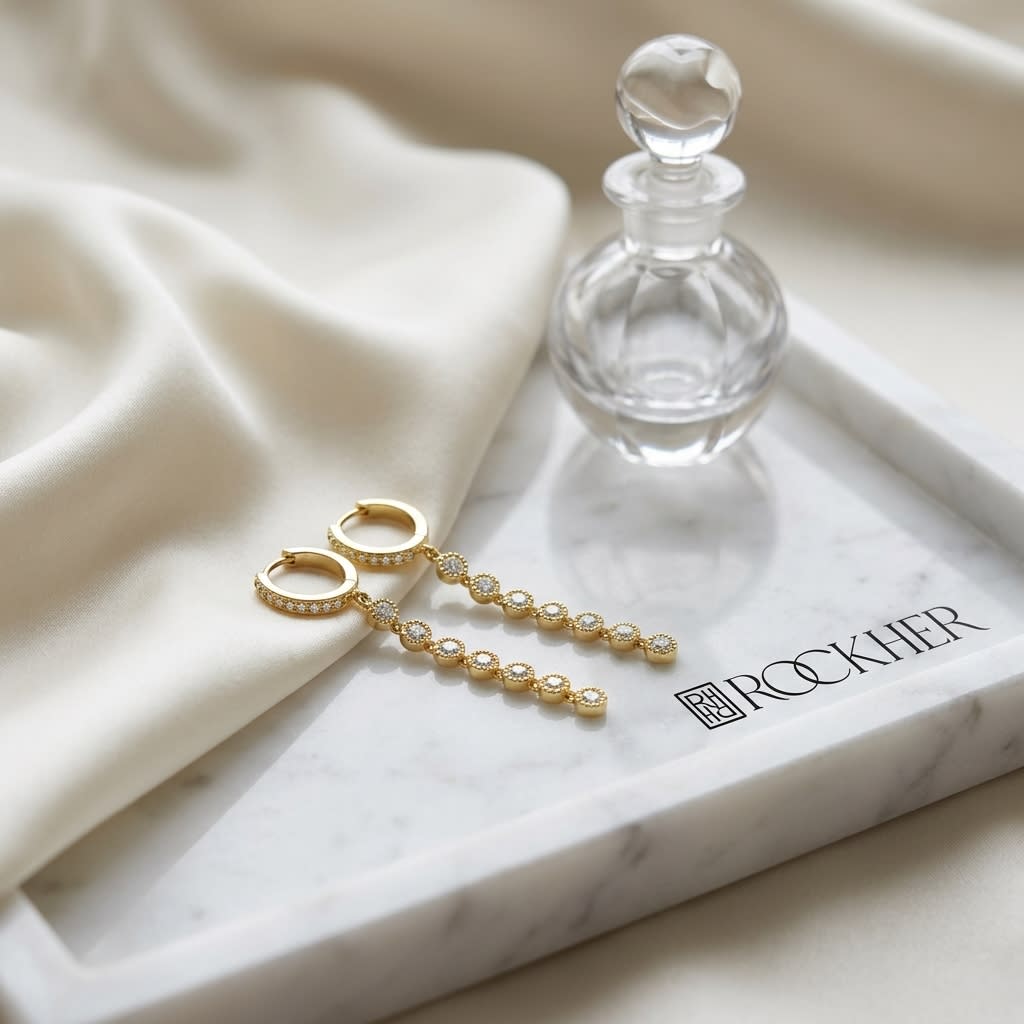 Diamond Milgrained Dangle Earring With Huggie Top in 14K Yellow Gold, on marble vanity tray with silk