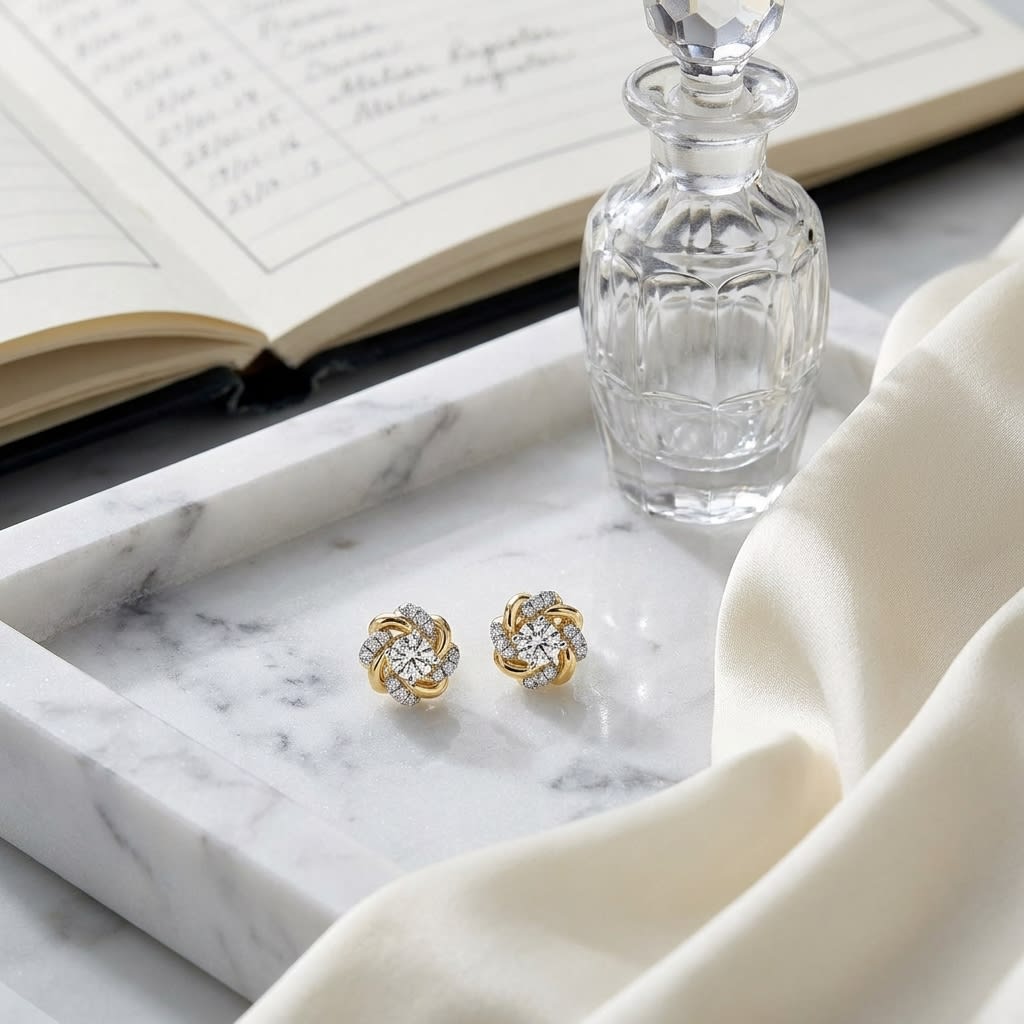Natural Diamond Round Brilliant Stud Earrings in 14K Yellow Gold, on marble vanity tray with silk