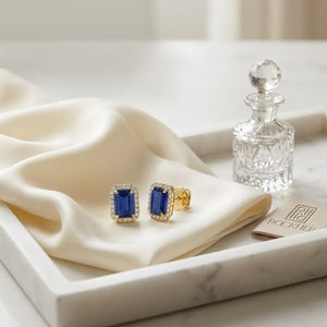 Sapphire and Diamond Halo Earrings in 14K Yellow Gold, 0.22ct, on marble vanity tray with silk