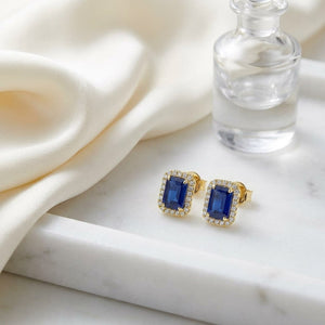 Sapphire Octagon Stud Earrings in 14K Yellow Gold, on marble vanity tray with silk
