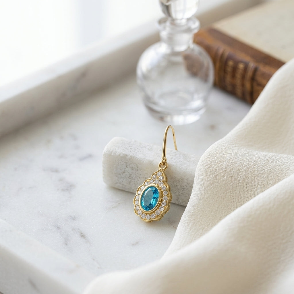 Blue Topaz & Diamond Oval Bezel Leverback Earrings with Teardrop Scallop Frame 1/2ctw in 14K Yellow Gold - editorial