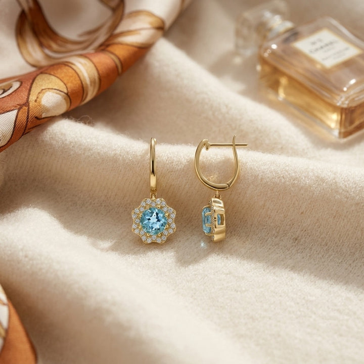 Blue Topaz & Diamond Round Brilliant Earrings in 14K Yellow Gold - flat lay