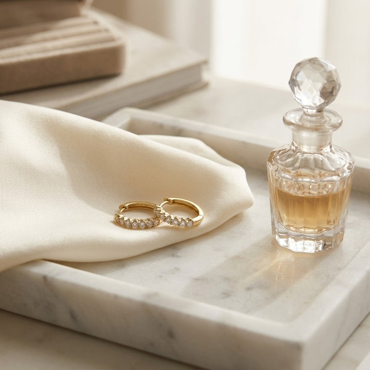 Diamond Oval Hoop Huggie Earrings 1/4ctw in 14K Yellow Gold - lifestyle