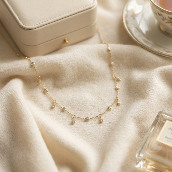 Diamond Station Necklace with Fixed & Dangling Bezels in 14K Yellow Gold - flat lay