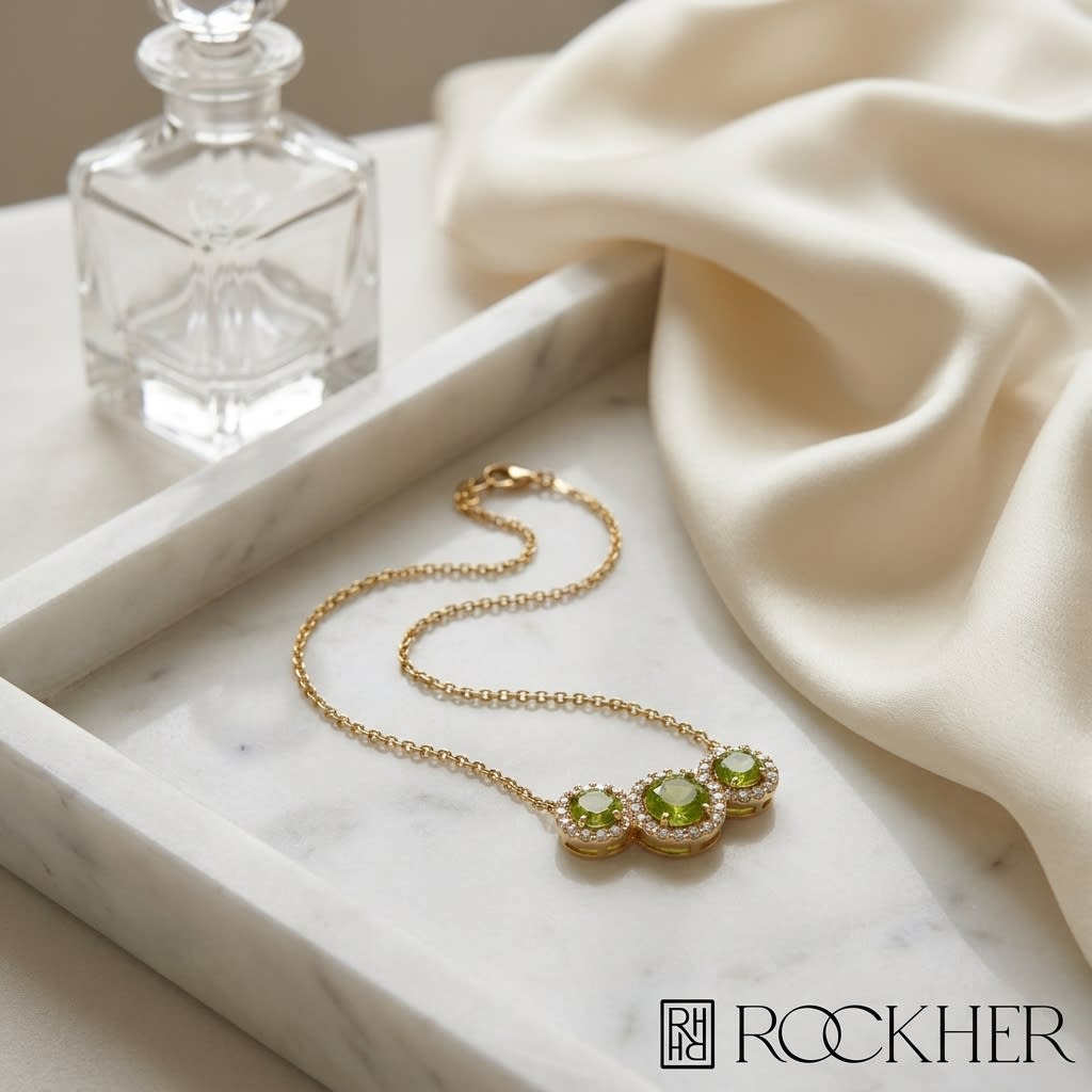 Round Peridot and Diamond Halo Necklace in 14K Yellow Gold, on marble vanity tray with silk