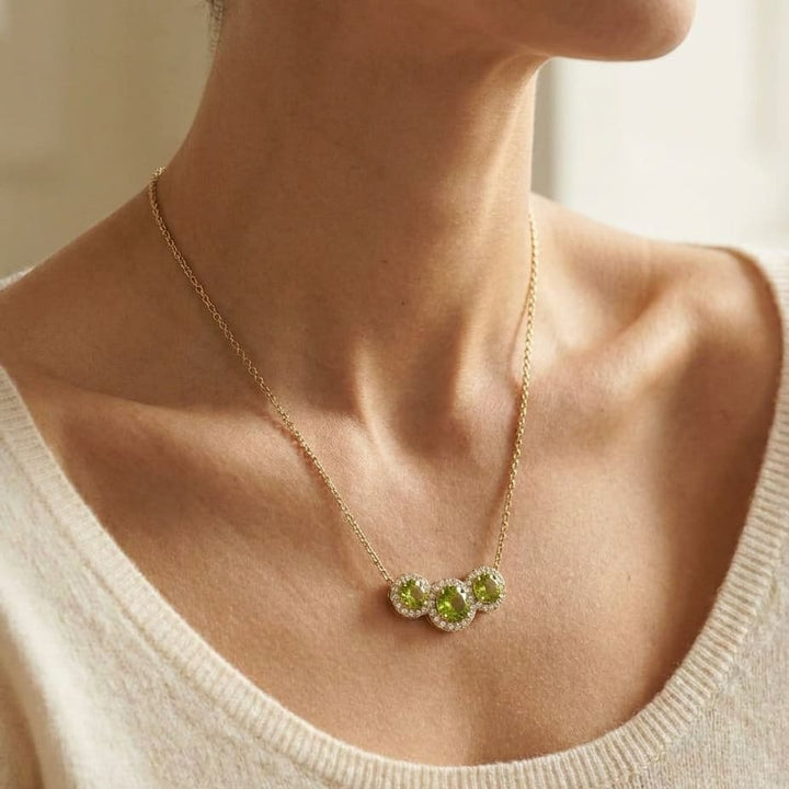 Round Peridot and Diamond Halo Necklace in 14K Yellow Gold, worn close-up portrait