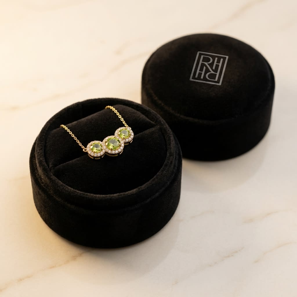 Round Peridot and Diamond Halo Necklace in 14K Yellow Gold, in navy velvet jewelry box