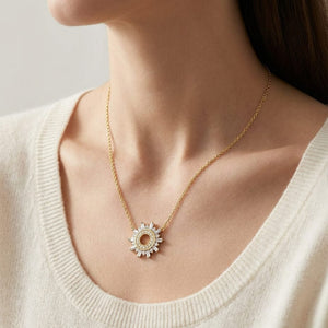 Diamond Round And Straight Baguette Starburst Necklace in 14K Yellow Gold, worn close-up portrait