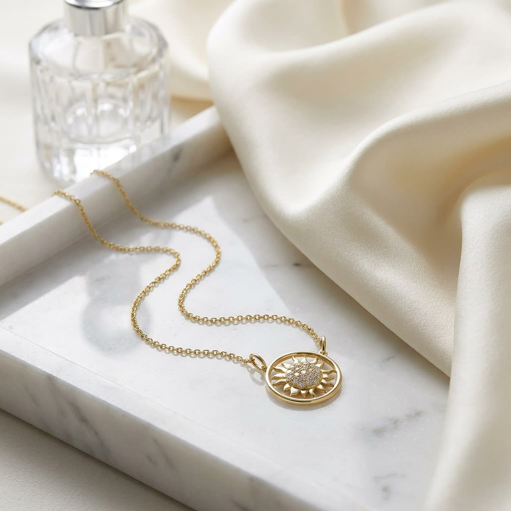 Diamond Sun Necklace With Round Frame in 14K Yellow Gold, on marble vanity tray with silk