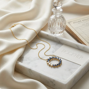 Sapphire And Diamond Marquise Wreath Necklace In 14k Yellow Gold 0.21ctw, on marble vanity tray with silk