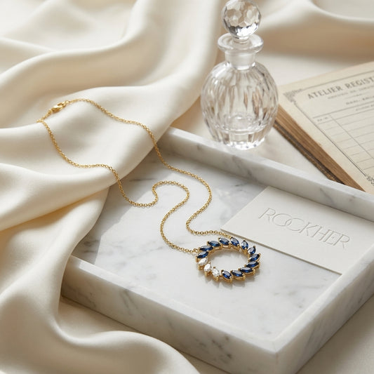 Sapphire And Diamond Marquise Wreath Necklace In 14k Yellow Gold 0.21ctw, on marble vanity tray with silk
