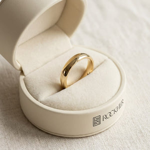 3mm Slightly Domed Traditional Oval Wedding Band in 14K Yellow Gold, in navy velvet jewelry box
