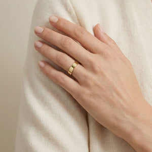 4mm Traditional Flat Wedding Band in 14K Yellow Gold, worn on hand, full view