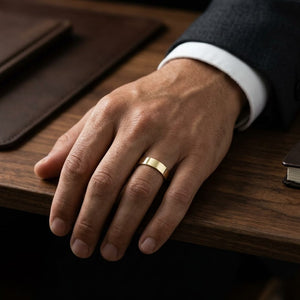 5mm Traditional Flat Wedding Band in 14K Yellow Gold, worn on hand, masculine full view