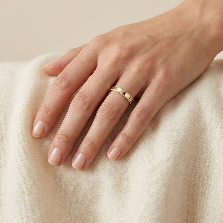 4mm Flat Milgrain Comfort-Fit Wedding Band in 14K Yellow Gold, worn on hand, full view