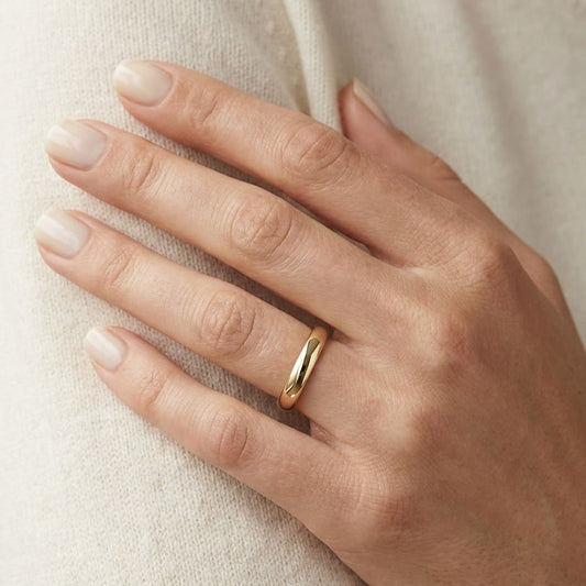 3mm High Dome Comfort-Fit Wedding Band in 14K Yellow Gold, worn on hand, close-up