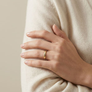3mm High Dome Comfort-Fit Wedding Band in 14K Yellow Gold, worn on hand, full view