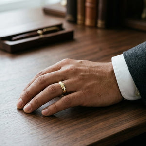 5mm High Dome Comfort-Fit Wedding Band in 14K Yellow Gold, worn on hand, masculine full view