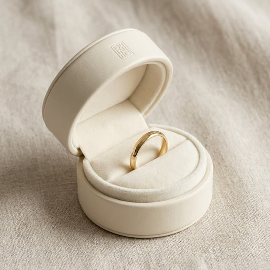 2.5mm Slightly Domed Comfort-Fit Wedding Band in 14K Yellow Gold, in navy velvet jewelry box