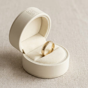 4mm Slightly Domed Milgrain Comfort-Fit Wedding Band in 14K Yellow Gold, in navy velvet jewelry box