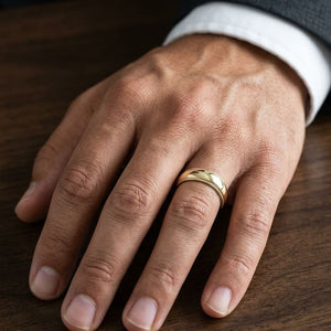 6mm Slightly Domed Milgrain Comfort-Fit Wedding Band in 14K Yellow Gold, worn on hand, masculine close-up