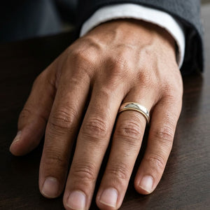 6mm Slightly Domed Double Milgrain Comfort-Fit Wedding Band in 14K Yellow Gold, worn on hand, masculine close-up