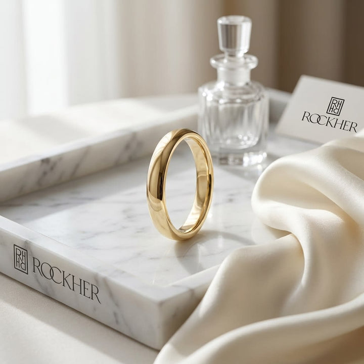 3mm Slightly Domed Super Light Comfort-Fit Wedding Band in 14K Yellow Gold, on marble vanity tray with silk