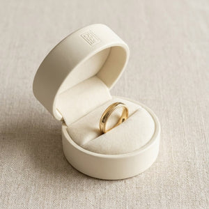 4mm Slightly Domed Super Light Milgrain Comfort-Fit Wedding Band in 14K Yellow Gold, in navy velvet jewelry box
