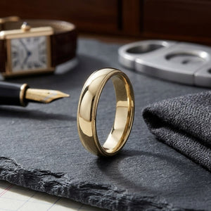5mm Slightly Domed Super Light Milgrain Comfort-Fit Wedding Band in 14K Yellow Gold, on walnut surface with pocket square