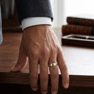 6mm High Polish Carved Wedding Band in 14K Yellow Gold, worn on hand, masculine full view