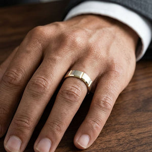6mm Satin Finish Grooves Carved Wedding Band in 14K Yellow Gold, worn on hand, masculine close-up