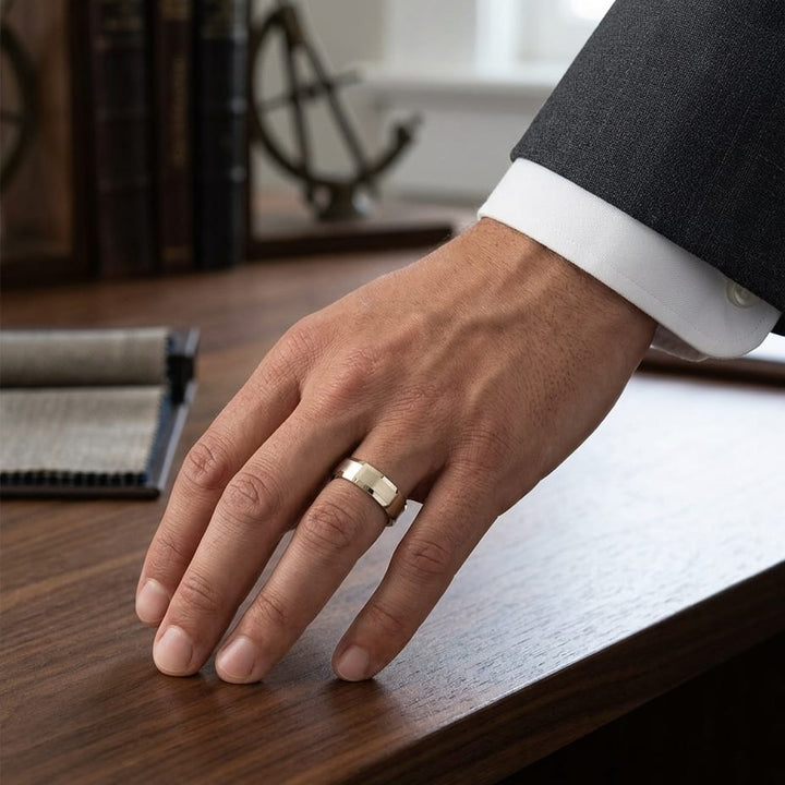 7mm Satin Finish Carved Wedding Band in 14K Yellow Gold, worn on hand, masculine full view