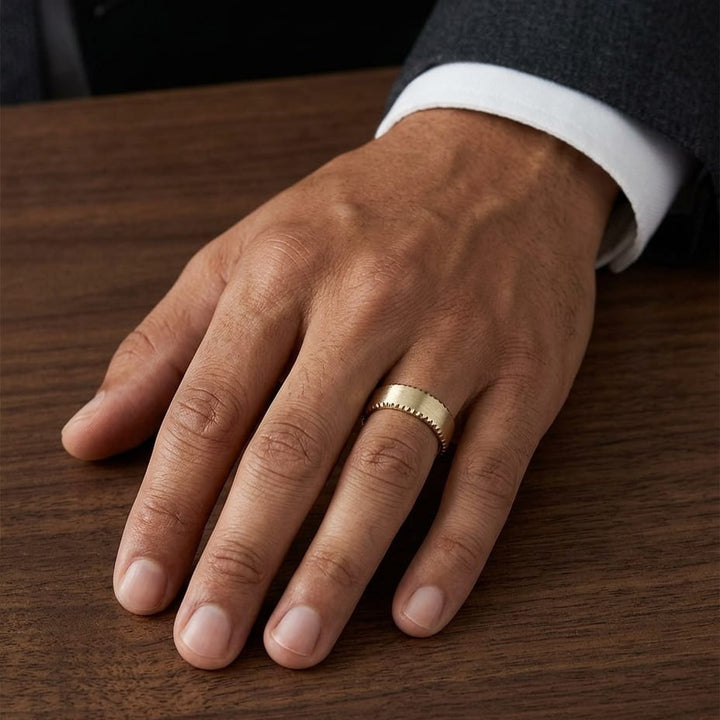 7.5mm Satin Finish Carved Wedding Band in 14K Yellow Gold, worn on hand, masculine full view