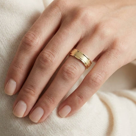 4mm Wired Finish High Polished Round Edge Carved Wedding Band in 14K Yellow Gold, worn on hand, close-up