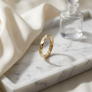 2mm High Polish Carved Wedding Band in 14K Yellow Gold, on marble vanity tray with silk