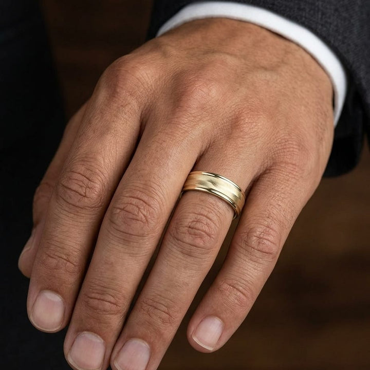 6mm High Polish Round Edge Carved Wedding Band in 14K Yellow Gold, worn on hand, masculine close-up