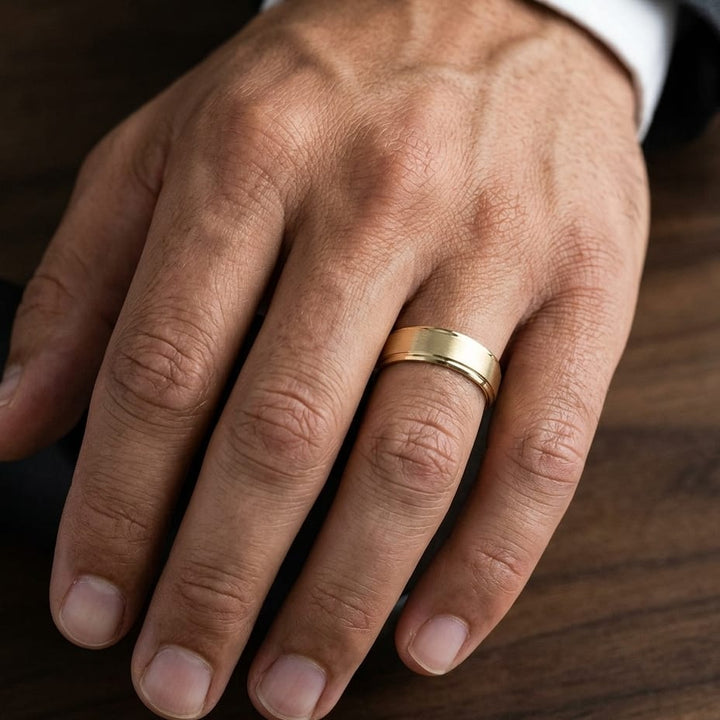 8mm Satin Finish High Polished Beveled Edge Carved Wedding Band in 14K Yellow Gold, worn on hand, masculine close-up