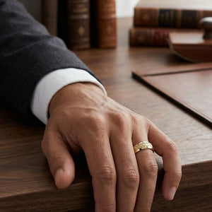 8mm Beveled Edge Treaded Carved Wedding Band in 14K Yellow Gold, worn on hand, masculine full view