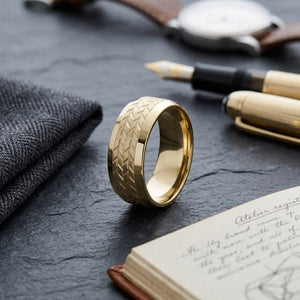 8mm Beveled Edge Treaded Carved Wedding Band in 14K Yellow Gold, on walnut surface with pocket square