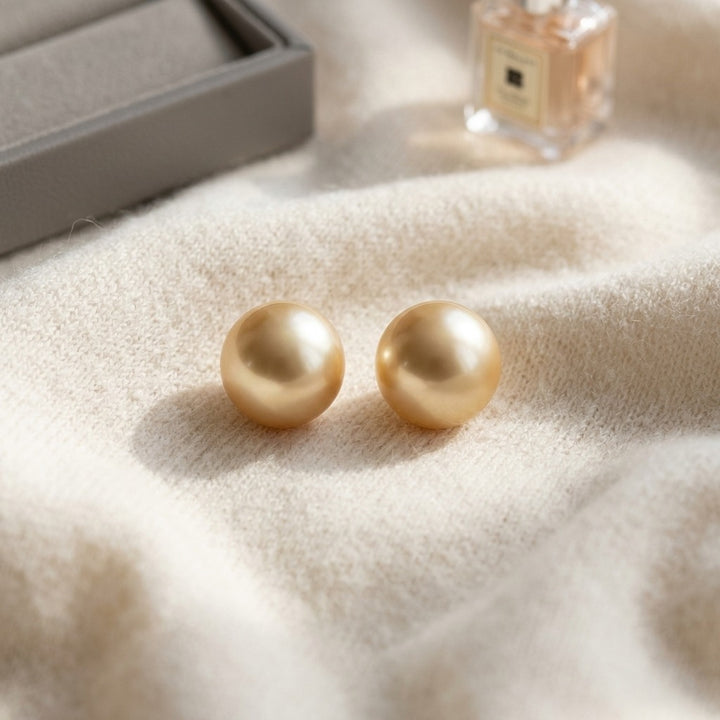 Golden South Sea Pearl Stud Earrings in 14K Yellow Gold - flat lay
