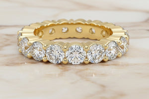Round brilliant lab diamond eternity band in 14K yellow gold — profile