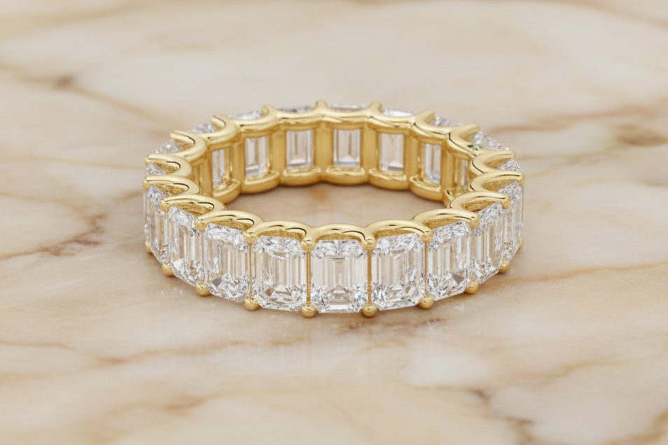 Emerald cut natural diamond eternity band in 14K yellow gold — front