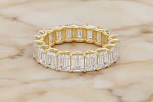Emerald cut natural diamond eternity band in 14K yellow gold, front
