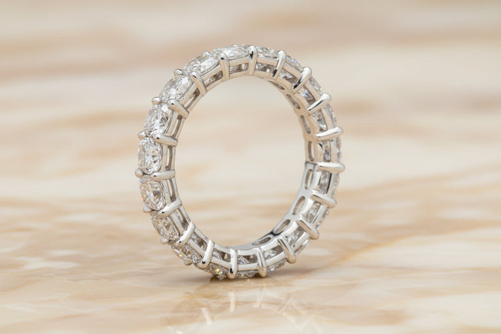 Cushion cut natural diamond eternity band in 14K white gold — profile