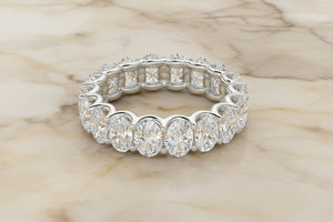 Oval cut natural diamond eternity band in 14K white gold, front