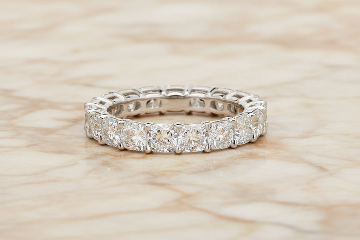 Cushion cut natural diamond eternity band in 14K white gold — front