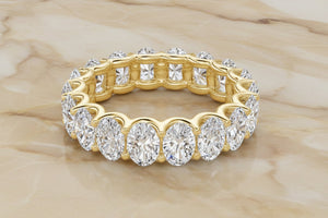 Oval cut natural diamond eternity band in 14K yellow gold, front