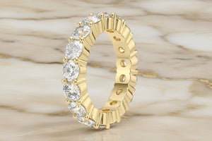 Round brilliant natural diamond eternity band in 14K white gold, profile